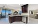 Kitchen with granite countertop island, stainless steel appliances, and breakfast bar at 88 Vivante Blvd # 8845/405, Punta Gorda, FL 33950