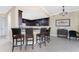Kitchen with breakfast bar and dark wood cabinetry at 88 Vivante Blvd # 8845/405, Punta Gorda, FL 33950
