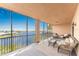 Spacious lanai with wicker furniture, offering stunning water views at 88 Vivante Blvd # 8845/405, Punta Gorda, FL 33950