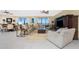 Spacious living room with large windows, comfortable seating, and tile floors at 88 Vivante Blvd # 8845/405, Punta Gorda, FL 33950