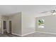Spacious bedroom with wood-look flooring and ceiling fan at 1430 Nora Ln, North Port, FL 34286