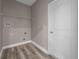Laundry room with vinyl flooring and shelving at 1430 Nora Ln, North Port, FL 34286