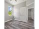 Simple bedroom with wood-look floors and a ceiling fan at 1430 Nora Ln, North Port, FL 34286