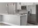 Modern kitchen with stainless steel appliances and white cabinets at 1430 Nora Ln, North Port, FL 34286