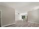 Open living room and kitchen with wood-look floors at 1430 Nora Ln, North Port, FL 34286