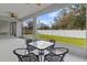 Spacious screened patio with outdoor furniture and scenic view at 1497 Nordendale Blvd, North Port, FL 34288