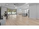 Open concept living and kitchen area with hardwood floors at 1497 Nordendale Blvd, North Port, FL 34288