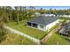 Aerial view of house, backyard, and surrounding neighborhood at 1497 Nordendale Blvd, North Port, FL 34288