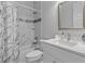 Clean bathroom with white vanity, marble shower, and a toilet at 1497 Nordendale Blvd, North Port, FL 34288