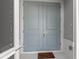Inviting front entrance with double doors and welcome mat at 1497 Nordendale Blvd, North Port, FL 34288