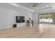 Spacious living room with hardwood floors and access to patio at 1497 Nordendale Blvd, North Port, FL 34288