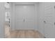 Bright entryway with double doors and wood floors at 1497 Nordendale Blvd, North Port, FL 34288