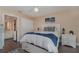 Bright bedroom with a queen-size bed, ceiling fan, and ample closet space at 150 Harborside Ave # 335, Punta Gorda, FL 33950