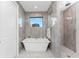 Bathroom with freestanding tub and walk-in shower at 2029 Padre Island Dr, Punta Gorda, FL 33950