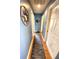 Light hallway with wood floors and access to bedrooms at 2250 Villa Green Ave, North Port, FL 34288