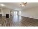 Open living room with wood-look floors and access to the kitchen at 3724 Laslo Ave, North Port, FL 34287