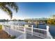 Covered boat lift and dock with waterfront access at 4201 Eagle Nest Ct, Port Charlotte, FL 33948