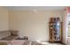 Living room with brown couch and display cabinet at 8170 Lombra Ave, North Port, FL 34287