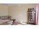 Living room with brown couch and display cabinet at 8170 Lombra Ave, North Port, FL 34287