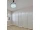 Bright bedroom with tile floors and double door closet at 8317 Denargo Rd, North Port, FL 34287