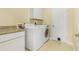 Laundry room with washer, dryer and granite countertop at 19359 Strathcona Ave, Port Charlotte, FL 33954