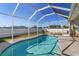 Inviting, screened-in pool with a large patio at 19359 Strathcona Ave, Port Charlotte, FL 33954