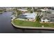 Property features a canal-front location with a private pool at 1230 Swan Ct, Punta Gorda, FL 33950