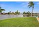 Peaceful waterfront view with lush grass at 1230 Swan Ct, Punta Gorda, FL 33950