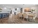 Open concept kitchen with a large island, stainless steel appliances, and a dining area at 1230 Swan Ct, Punta Gorda, FL 33950