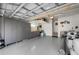 Organized garage with storage cabinets and overhead rack at 1230 Swan Ct, Punta Gorda, FL 33950
