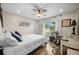 Bedroom with a queen bed, built in desk, and ceiling fan at 1230 Swan Ct, Punta Gorda, FL 33950