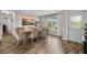 Dining room with hardwood floors, a wood table, and a view to the backyard at 1230 Swan Ct, Punta Gorda, FL 33950