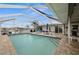 Large screened pool and patio overlooking the canal at 1230 Swan Ct, Punta Gorda, FL 33950