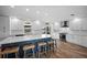 Bright kitchen with white cabinets, a large island, and stainless steel appliances at 1230 Swan Ct, Punta Gorda, FL 33950