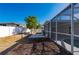 Fenced backyard with screened-in pool and patio at 170 Chelsea Nw Ct, Port Charlotte, FL 33952
