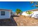 Backyard with landscaping, trees, and a white fence at 170 Chelsea Nw Ct, Port Charlotte, FL 33952