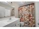 Clean bathroom with white vanity, floral shower curtain, and mirror at 170 Chelsea Nw Ct, Port Charlotte, FL 33952