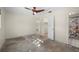 Spacious bedroom with a ceiling fan, closet, and ensuite bathroom access at 170 Chelsea Nw Ct, Port Charlotte, FL 33952