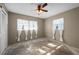 Bright bedroom with ceiling fan, sheer curtains, and ample natural light at 170 Chelsea Nw Ct, Port Charlotte, FL 33952