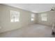 Empty bedroom with light gray walls and multiple windows with blinds at 170 Chelsea Nw Ct, Port Charlotte, FL 33952