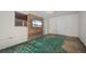 Bonus room with built-in entertainment center and green flooring at 170 Chelsea Nw Ct, Port Charlotte, FL 33952