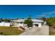 Charming single-story home with white exterior, fenced yard, and driveway at 170 Chelsea Nw Ct, Port Charlotte, FL 33952