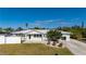 Single-story home with white exterior, landscaping, and driveway at 170 Chelsea Nw Ct, Port Charlotte, FL 33952