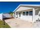 Front entrance and driveway of the single-story home with landscaping at 170 Chelsea Nw Ct, Port Charlotte, FL 33952