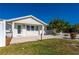 Close-up view of the inviting front entrance with a charming front porch at 170 Chelsea Nw Ct, Port Charlotte, FL 33952