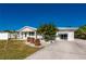 Picturesque single-story home with a well-maintained front yard and driveway at 170 Chelsea Nw Ct, Port Charlotte, FL 33952