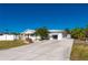 Charming single-story home with a welcoming front yard and paved driveway at 170 Chelsea Nw Ct, Port Charlotte, FL 33952