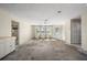 Living room with ample natural light, ceiling fan, and access to a side room at 170 Chelsea Nw Ct, Port Charlotte, FL 33952