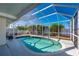 Screened-in pool with a white fence and some trees at 170 Chelsea Nw Ct, Port Charlotte, FL 33952