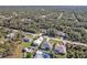 Aerial view of a residential area showing homes, roads, and lush greenery at 17152 Wintergarden Ave, Port Charlotte, FL 33948